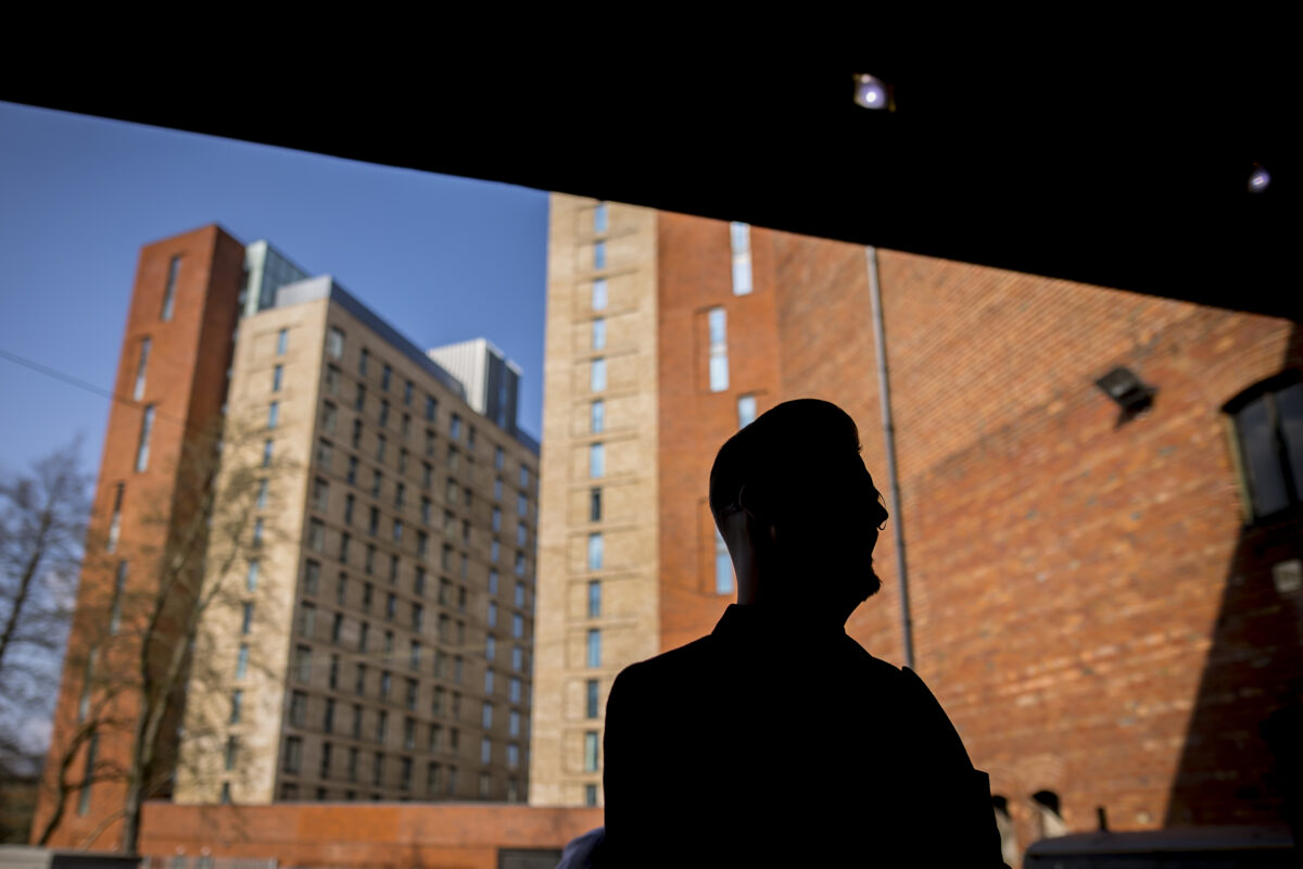 Silhouette of person with urban buildings background