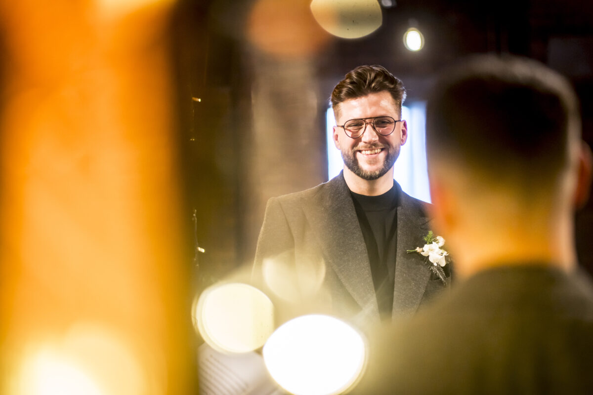 Man smiling at an event.