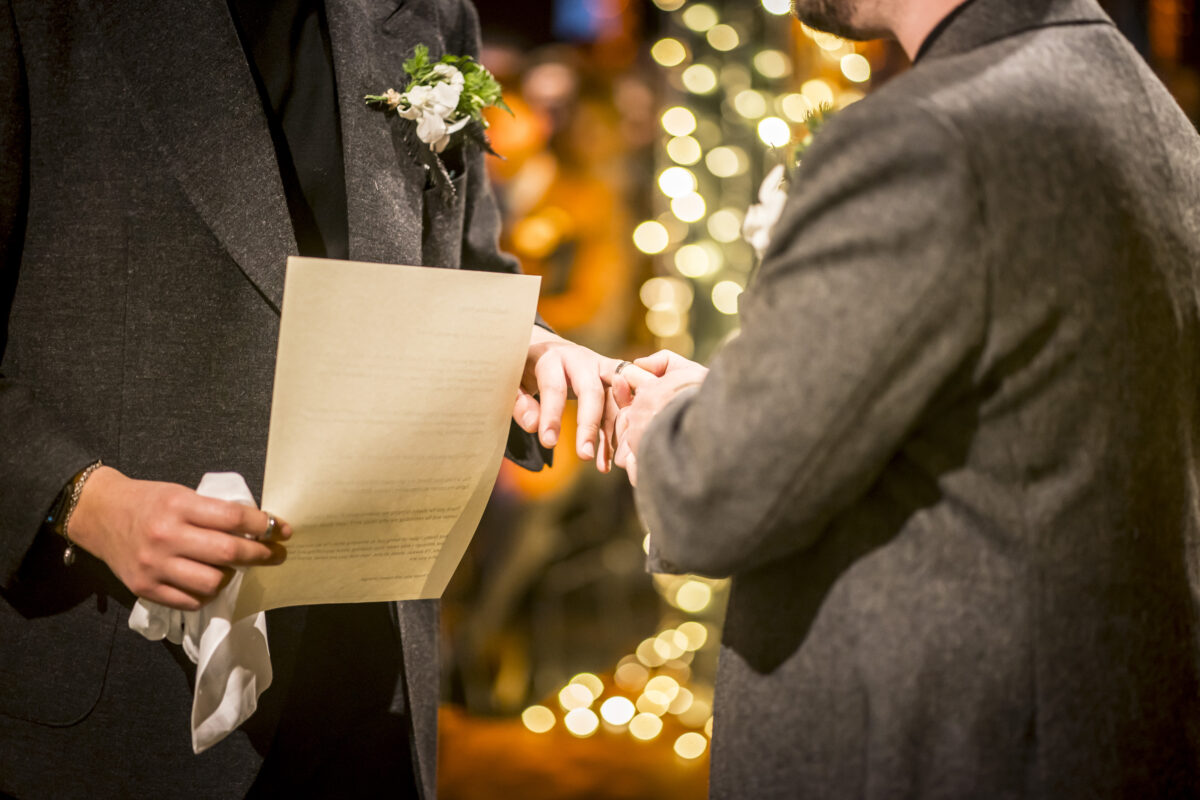 Two people exchanging rings during a wedding ceremony