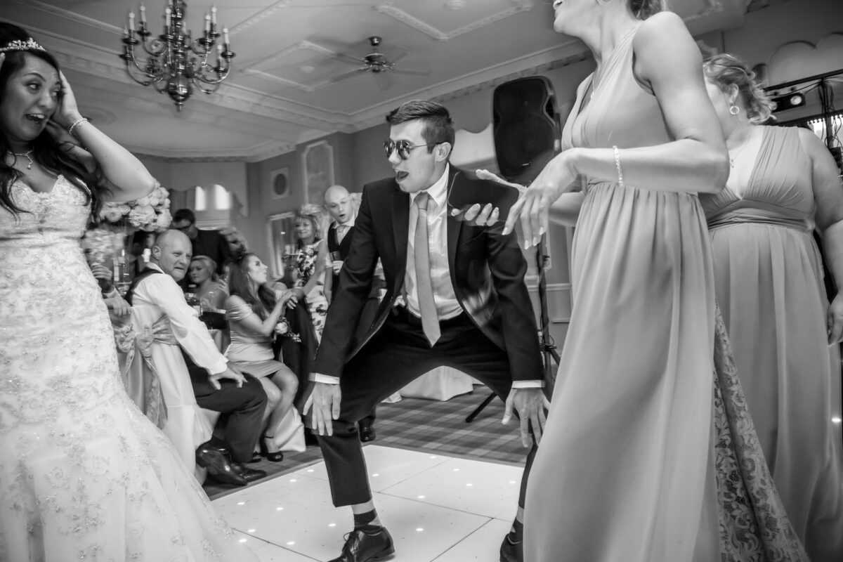 Lively wedding party with dancing and celebration.