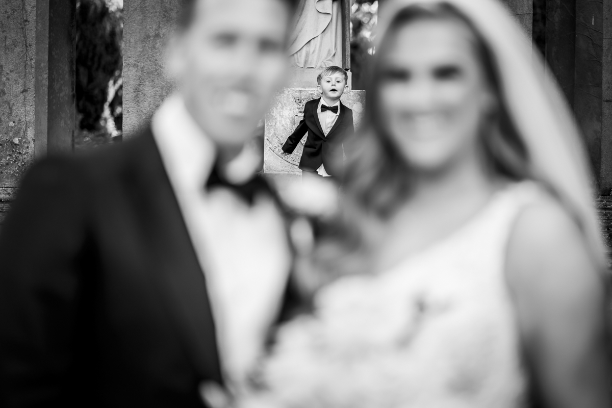 Child photobombs wedding couple's photo, black and white