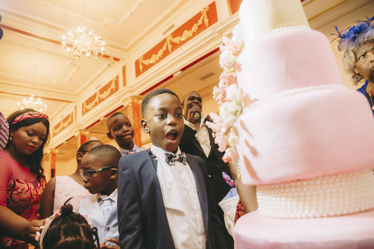 Boy amazed by large wedding cake