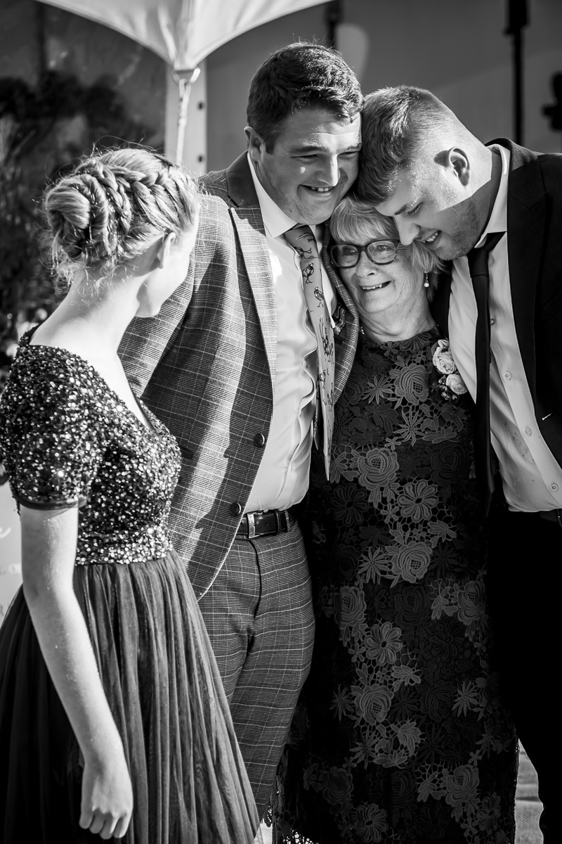 Family hugging happily at a celebration