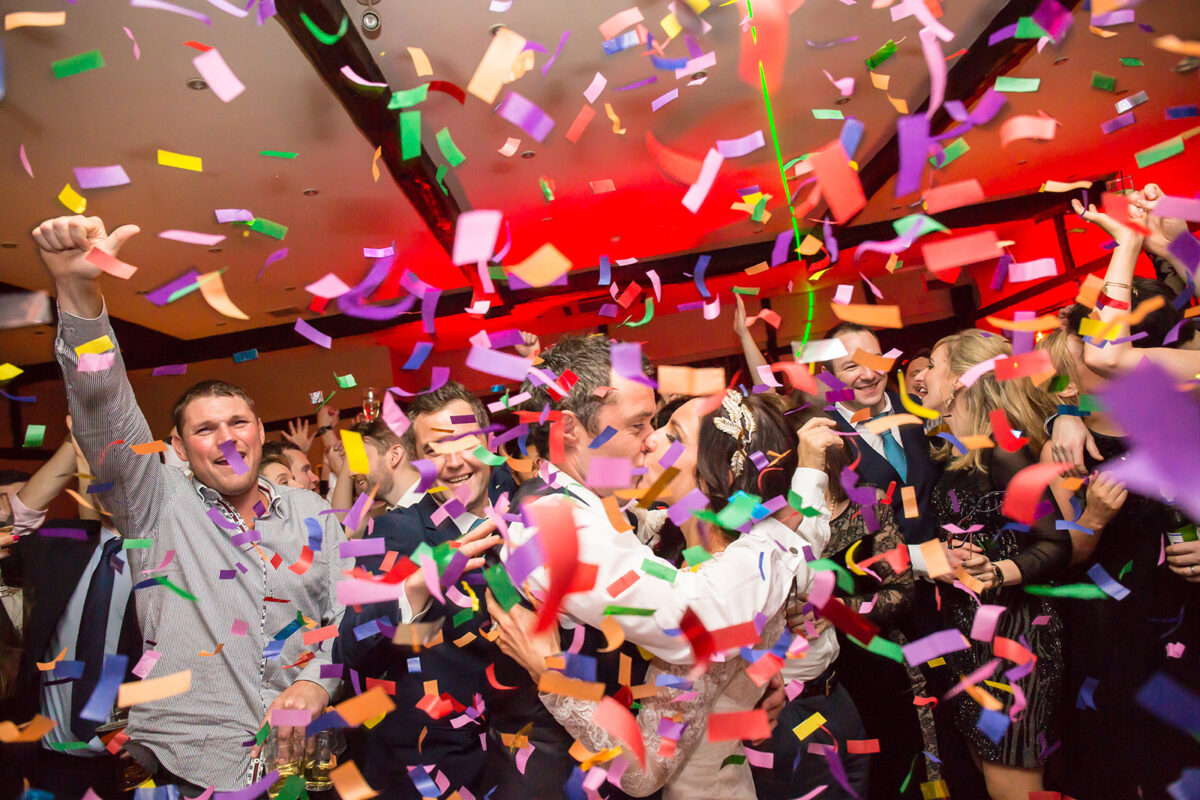 Party celebration with colourful confetti falling around.