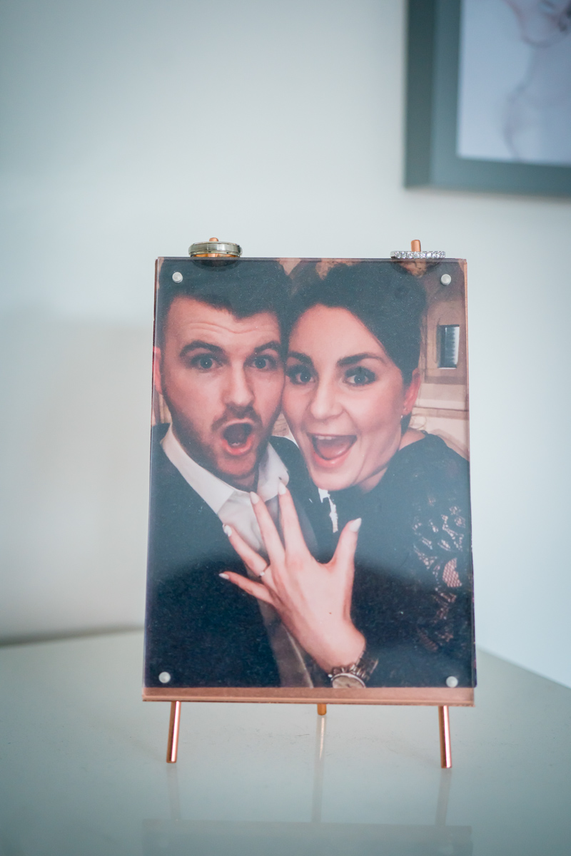 Engaged couple celebrating with excitement and joy.