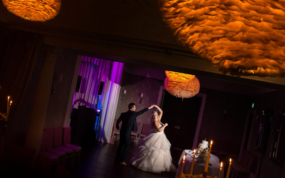 Couple dancing at wedding reception, elegant setting