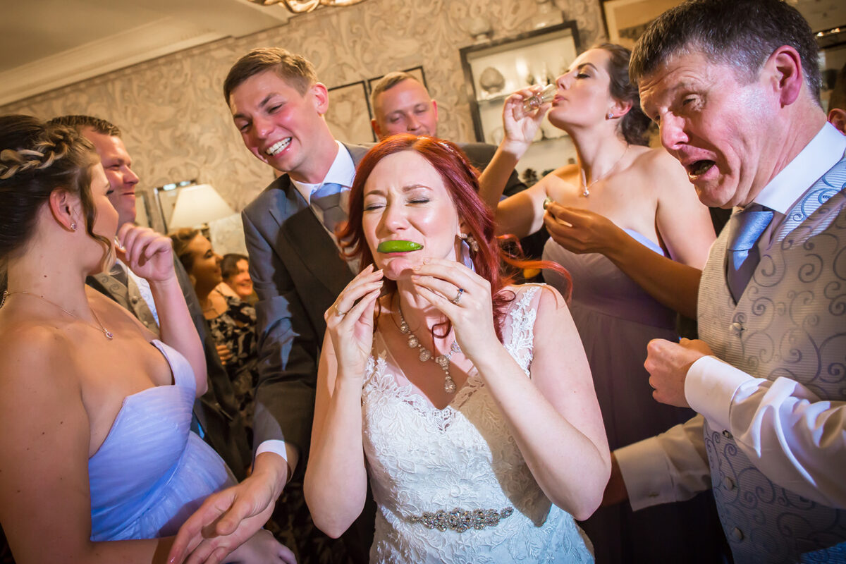 Wedding party enjoying shots with lime.