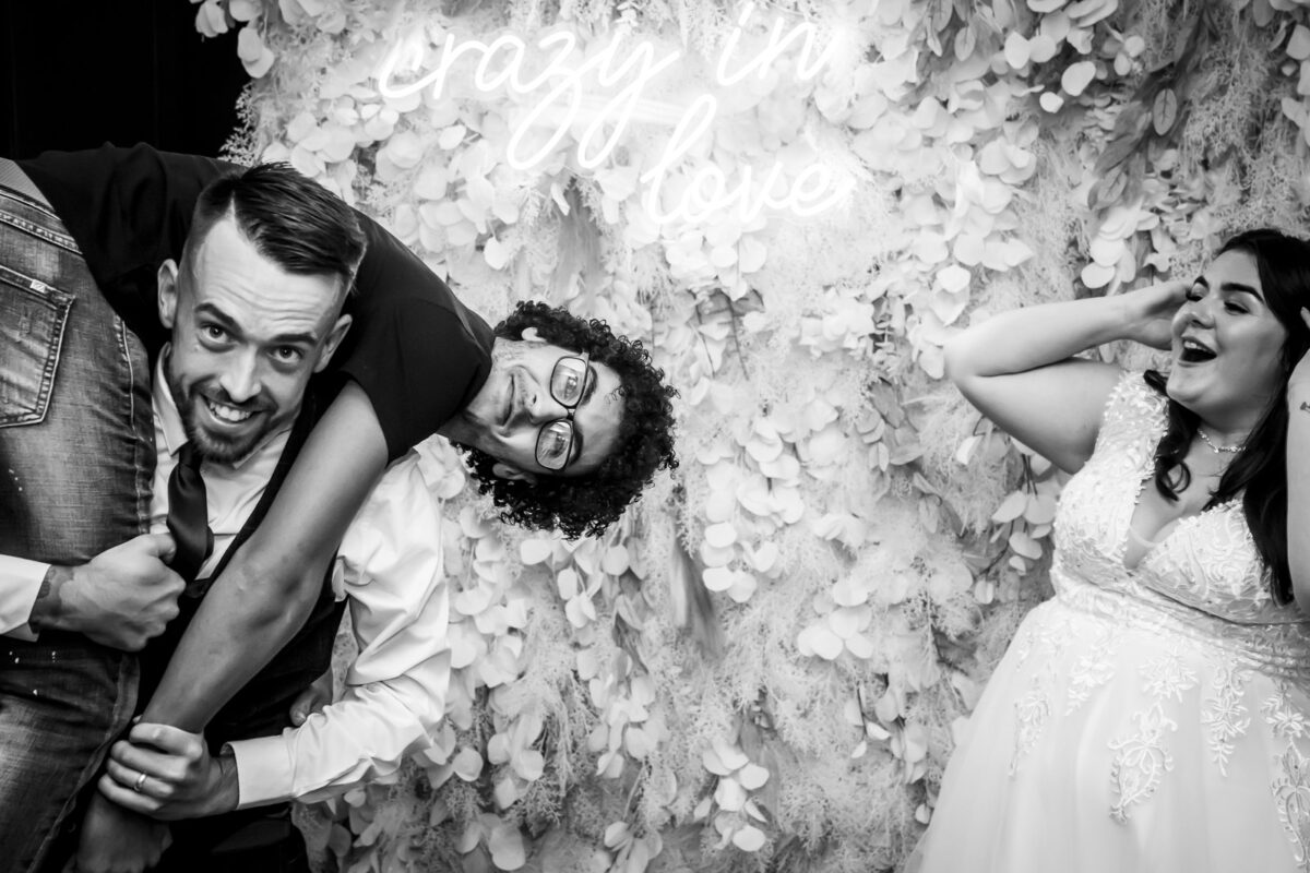 Wedding celebration with playful lift and laughter.
