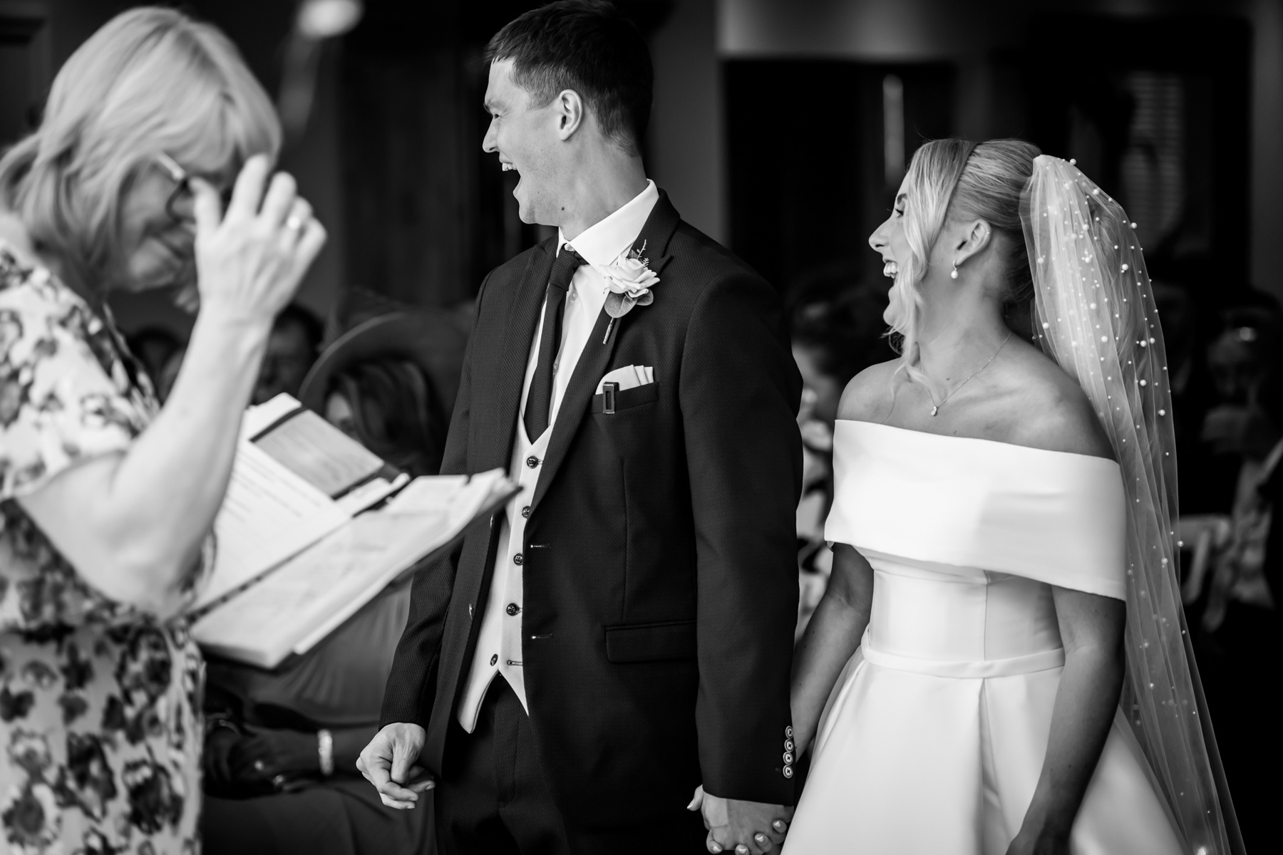 Bride and groom laughing during wedding ceremony