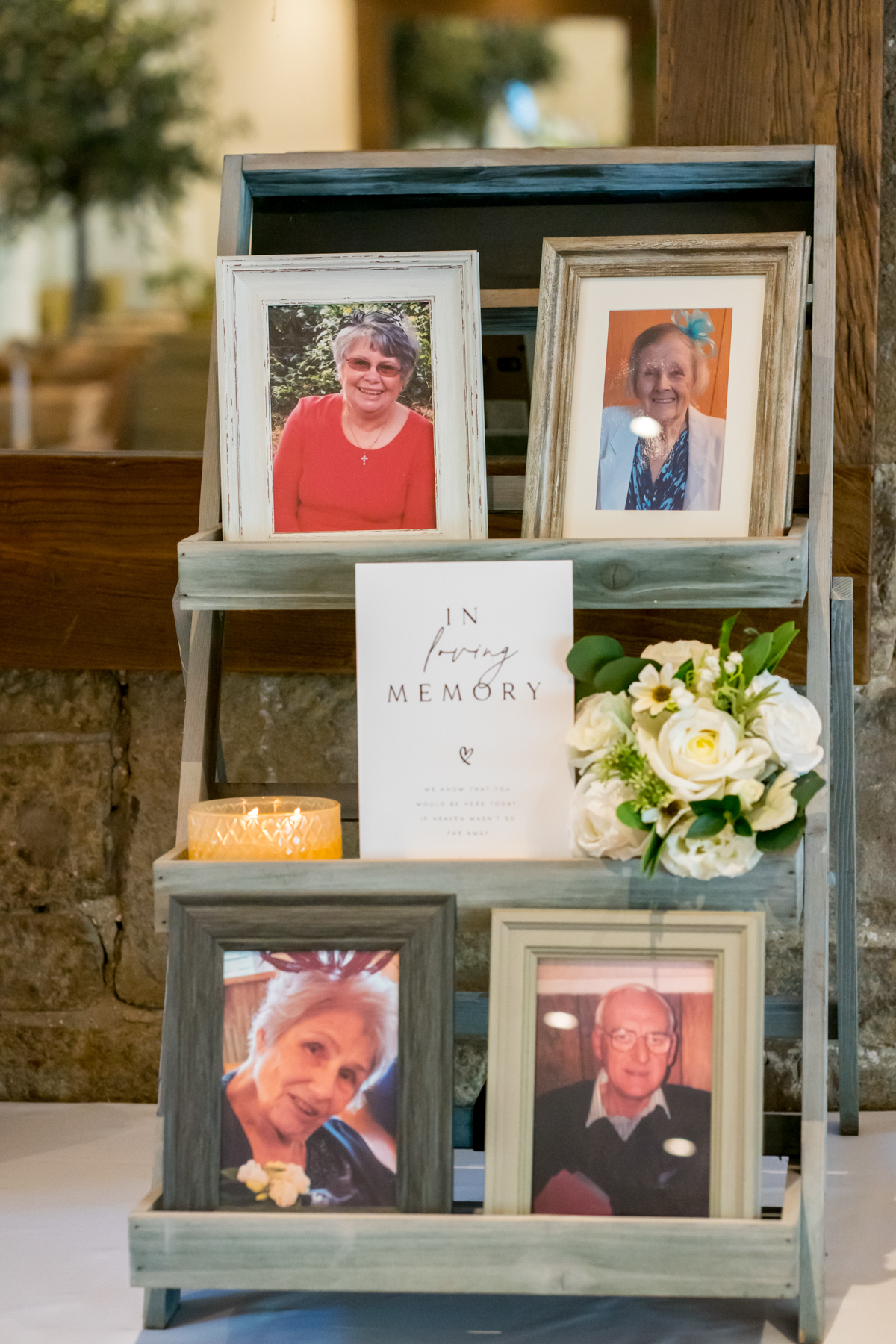 Memorial display with photos and candle.