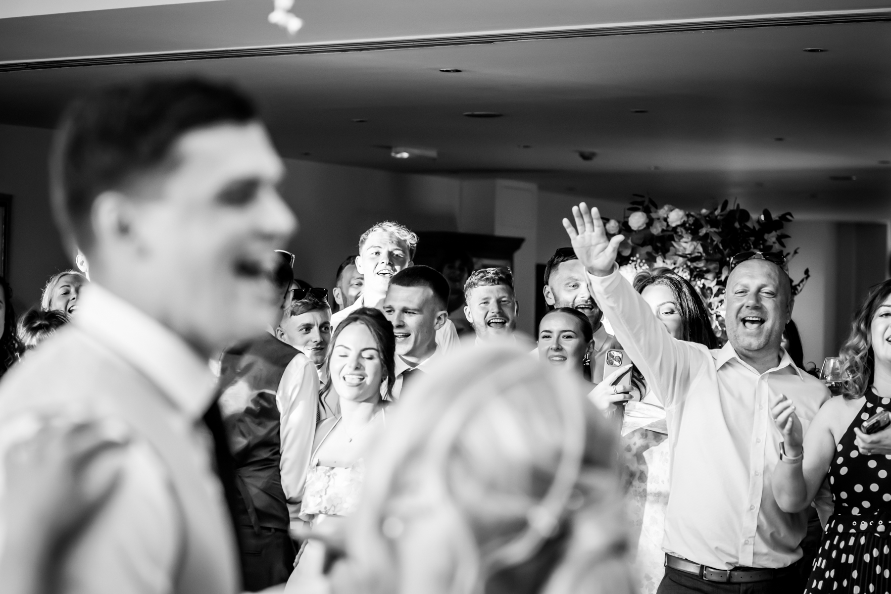 Joyful wedding guests enjoying a celebration.