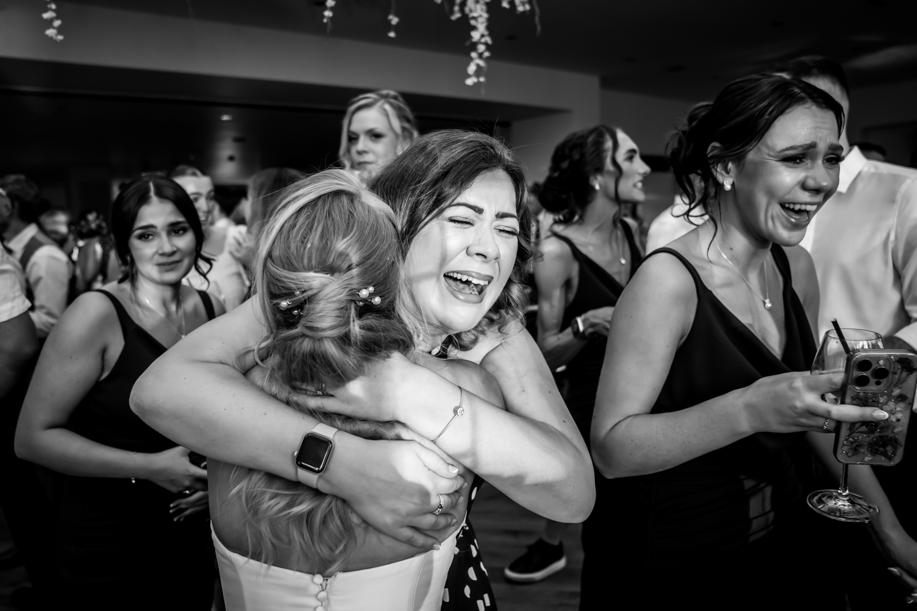 Group celebrating at joyful wedding reception