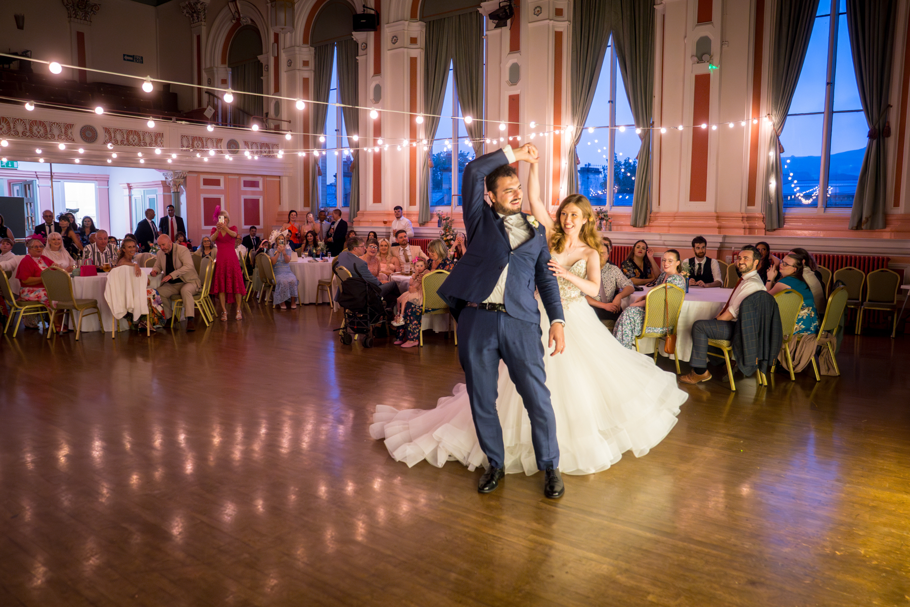 Bride and groom dance at wedding reception.