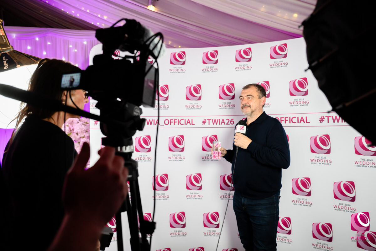 Man holding award at The Wedding Industry Awards 2026.