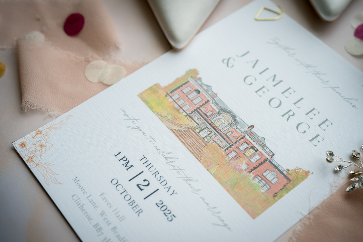 Elegant wedding invitation with floral details.