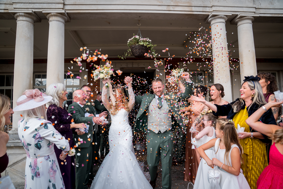 Wedding celebration with confetti outside building