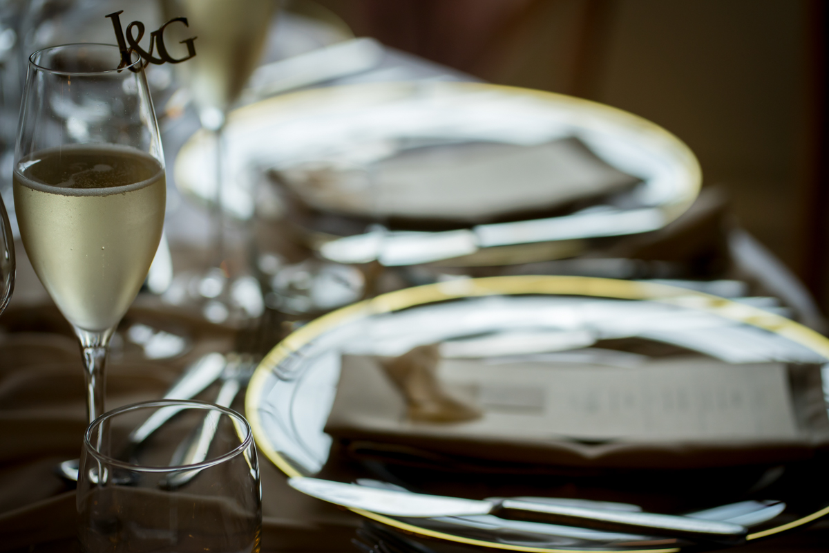 Elegant table setting with champagne glass.
