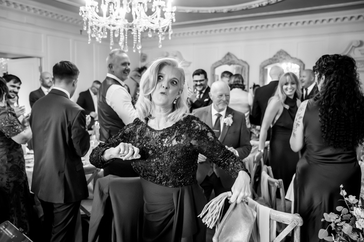 Guests enjoying lively wedding reception celebration.