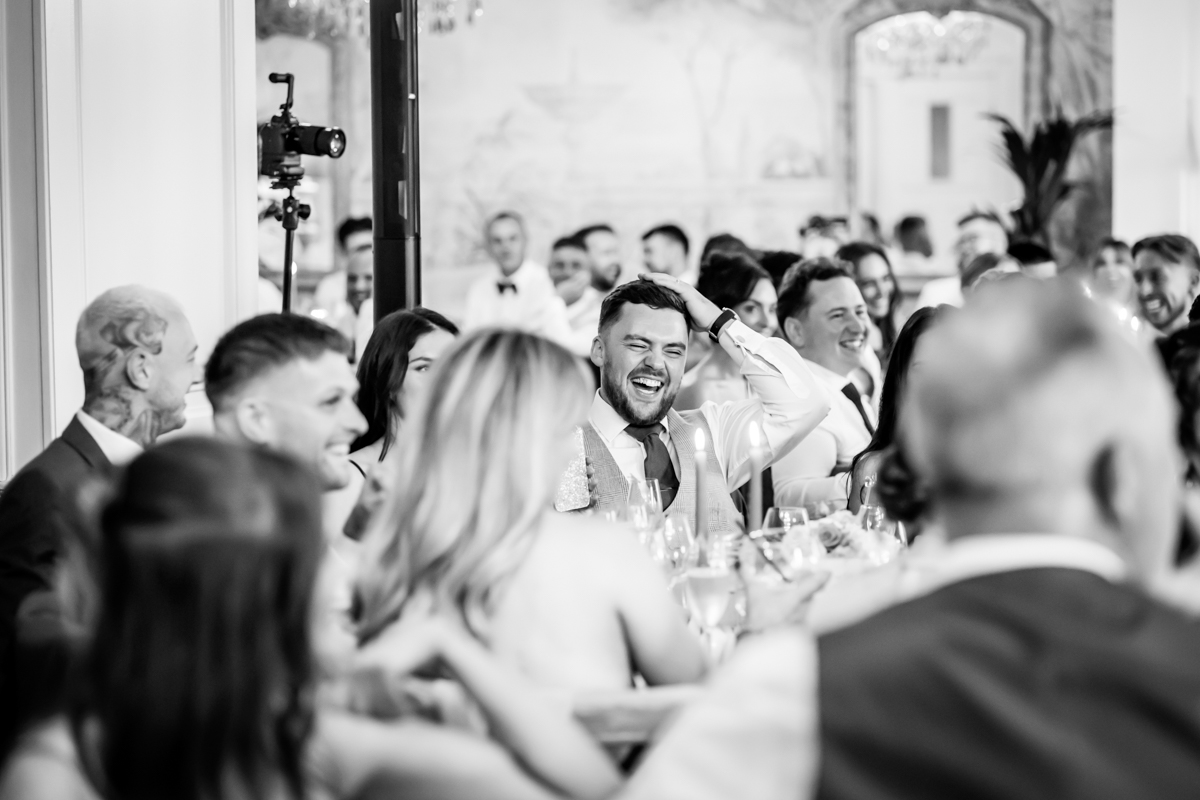 Guests laughing at wedding reception