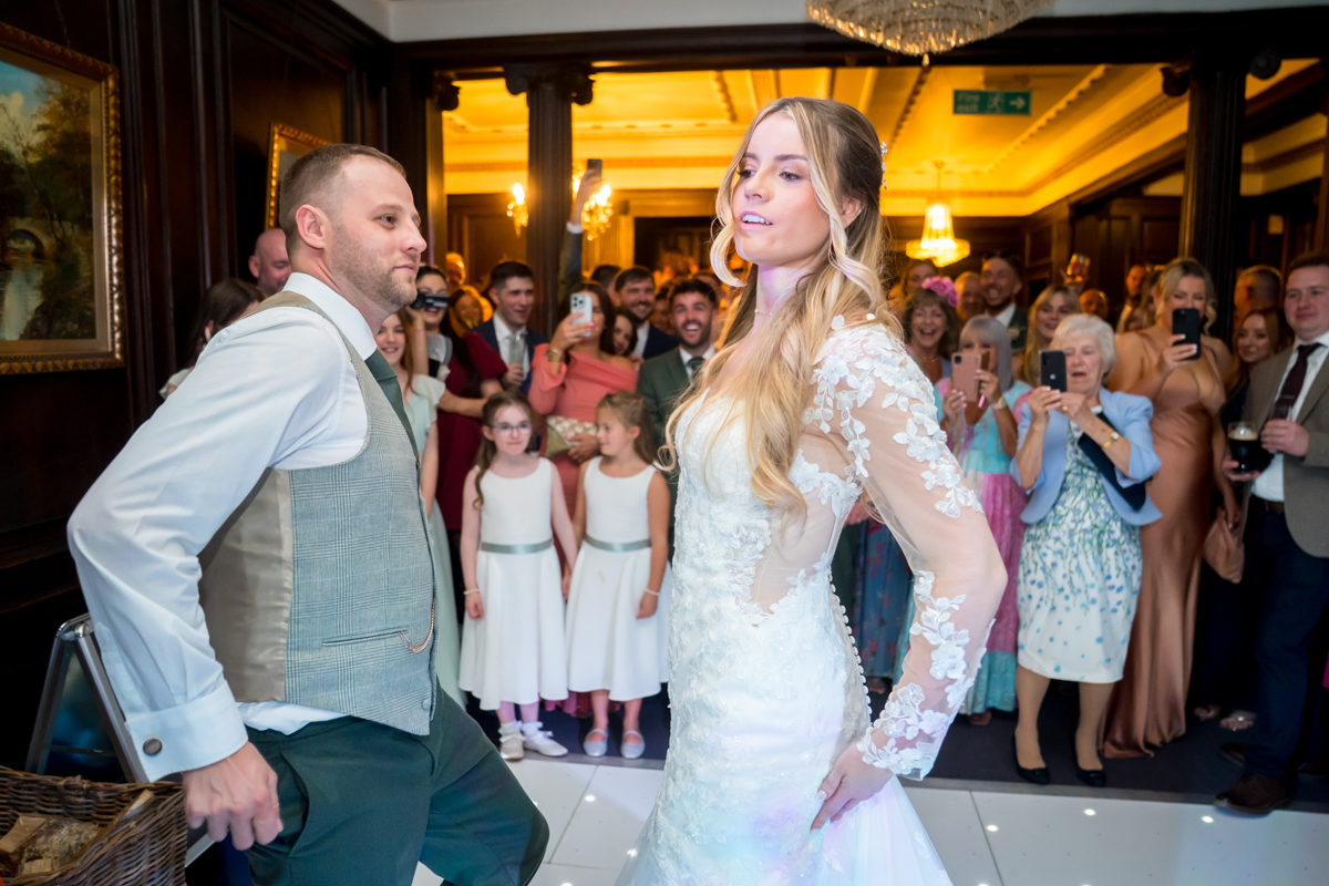 Bride and groom dancing at wedding reception.