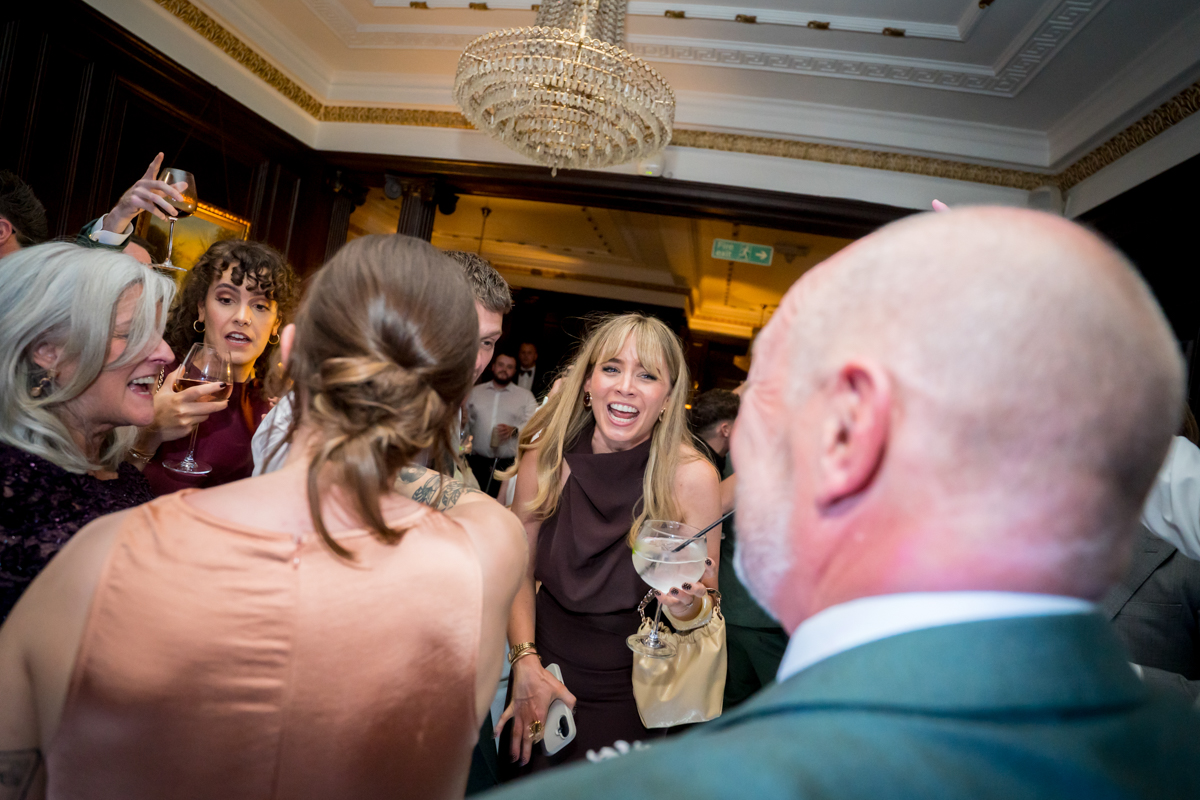 Group of people laughing at a party