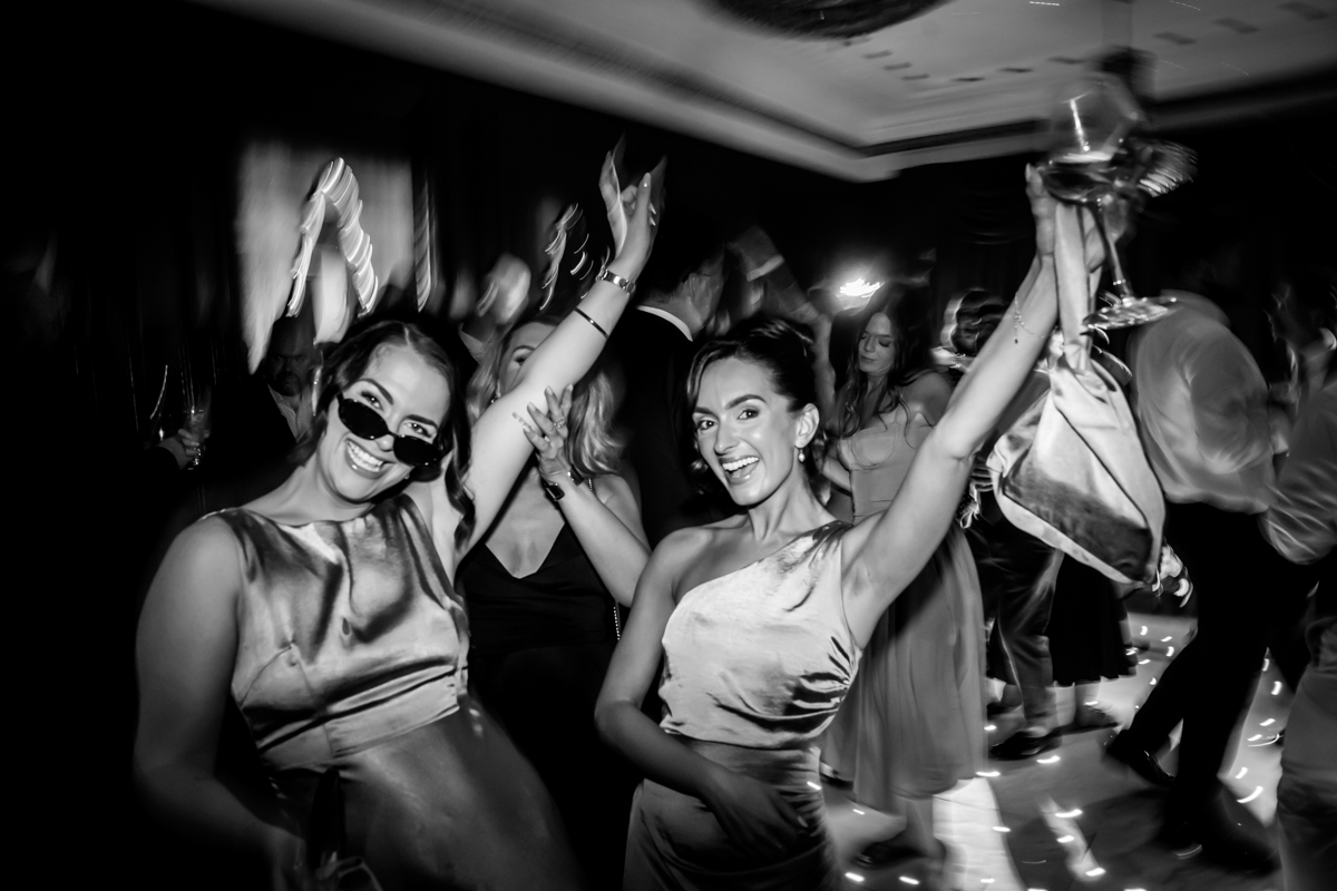 People dancing and celebrating at a festive event.