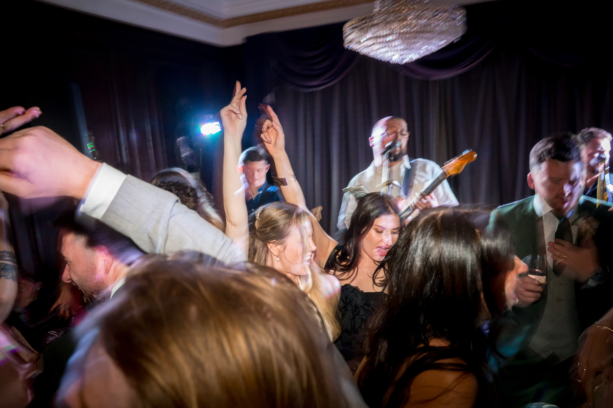 People dancing energetically at a lively party.