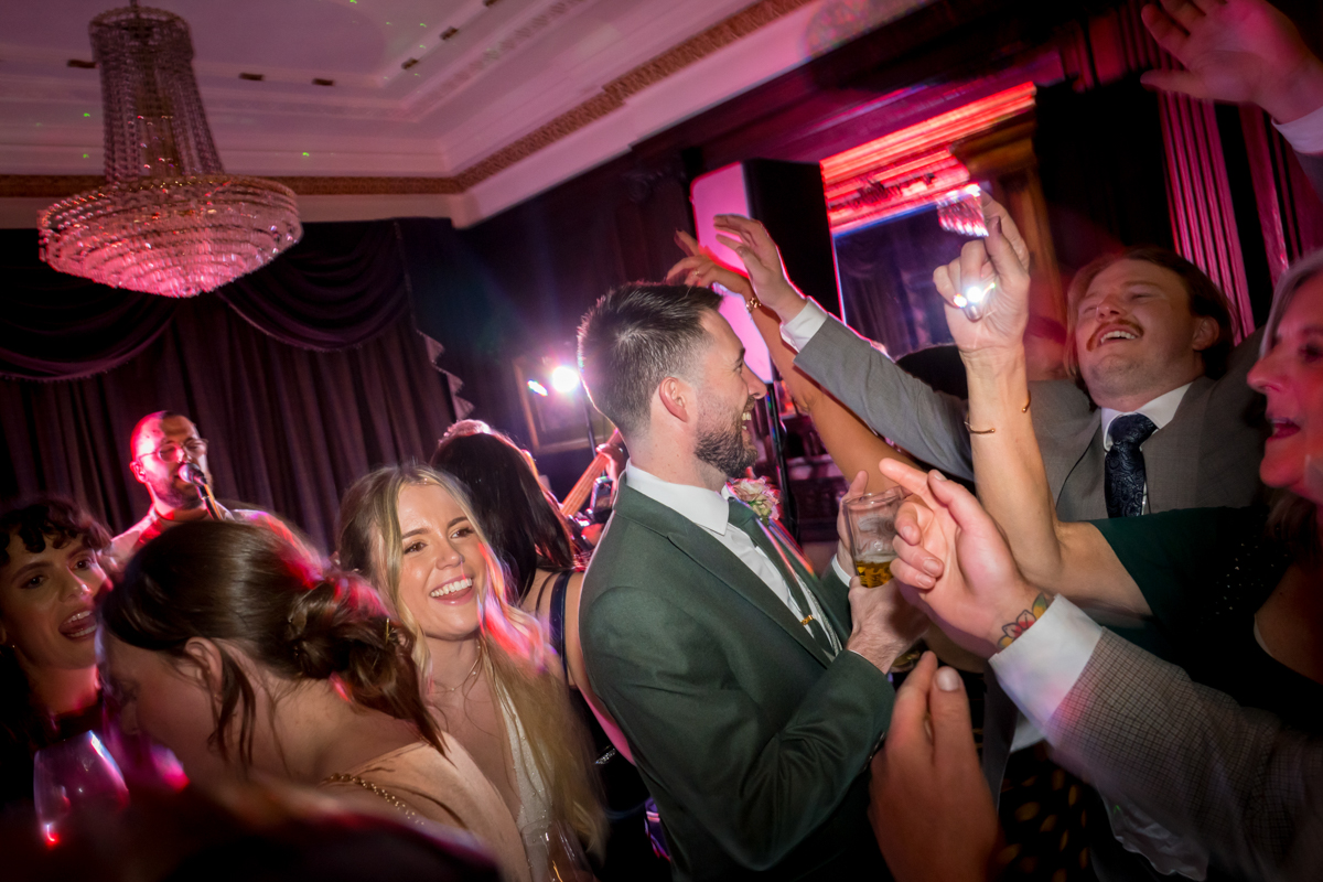 People joyfully dancing at a party.
