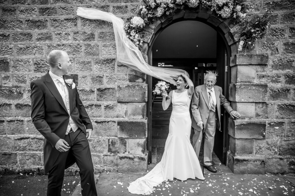 Bride's veil caught by the wind