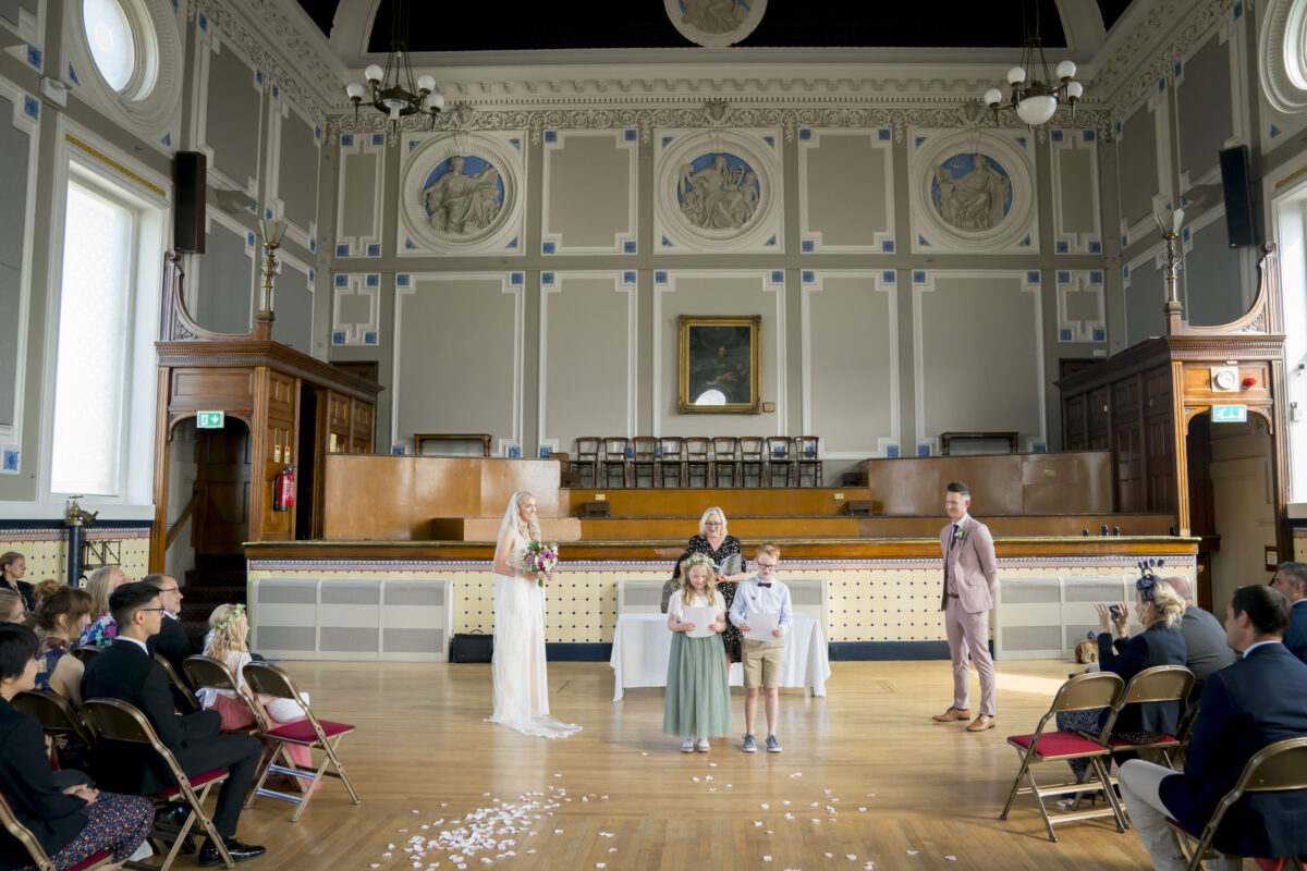 Wedding ceremony in a grand hall.
