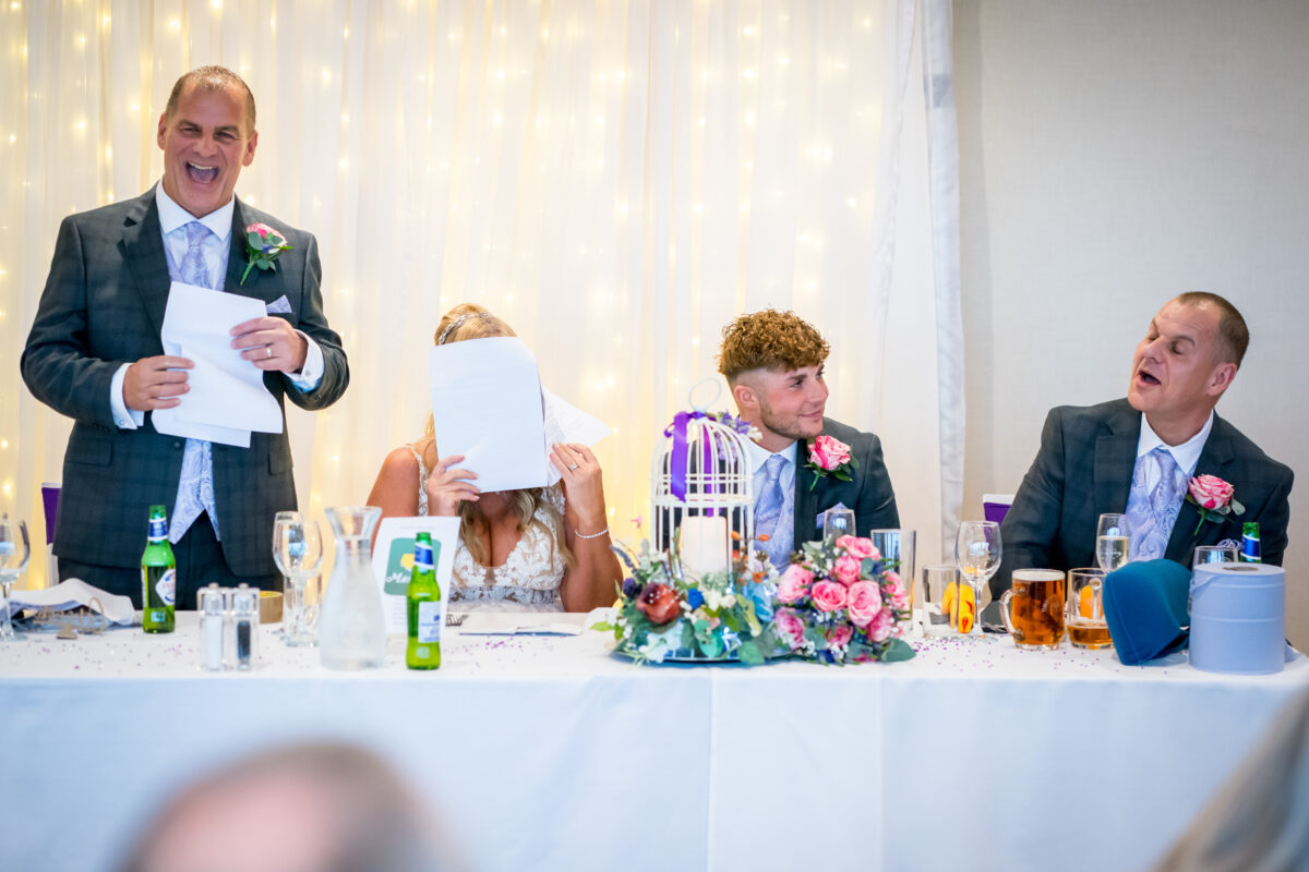 Wedding reception speech with amused guests
