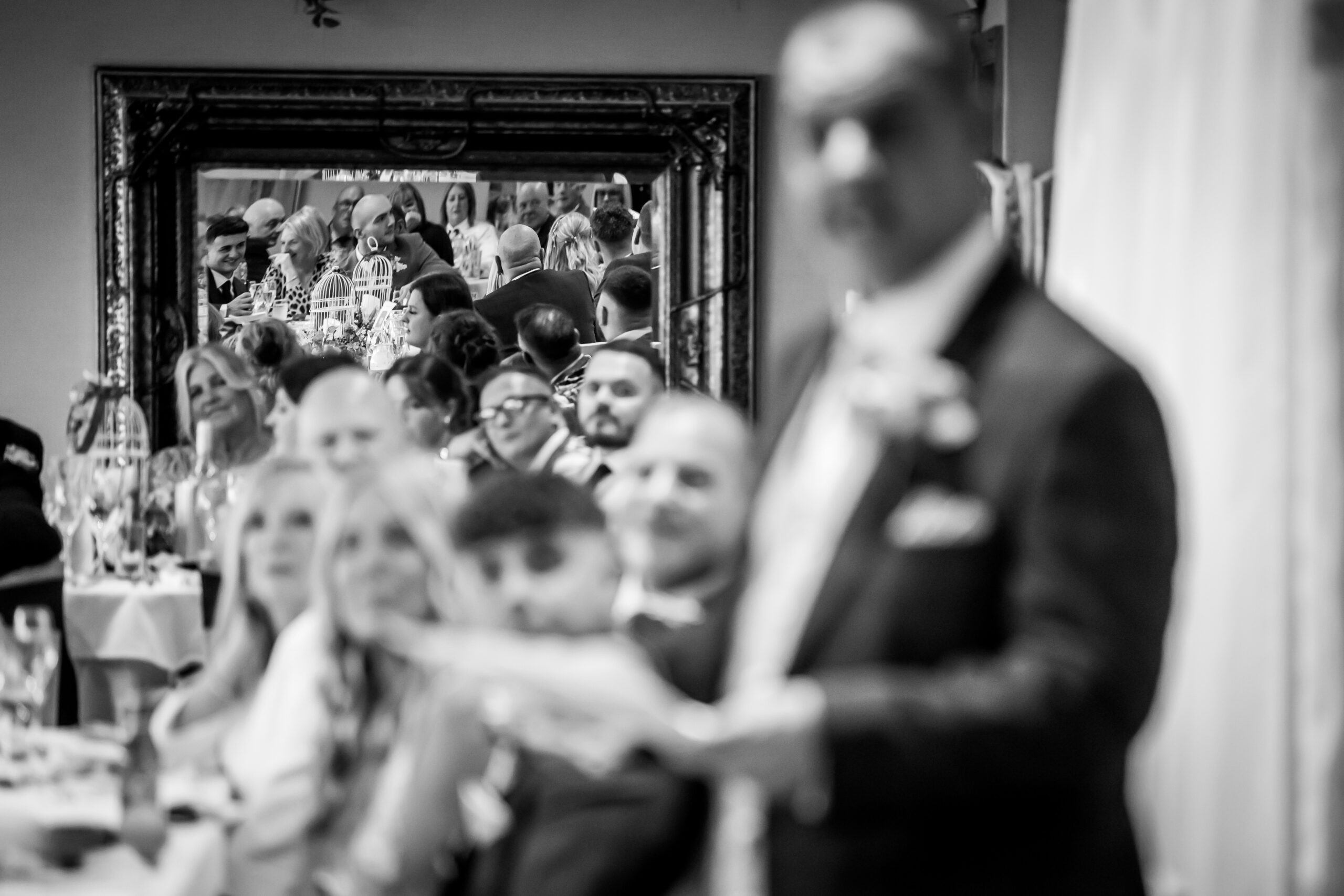 Wedding guests and mirrored reflections