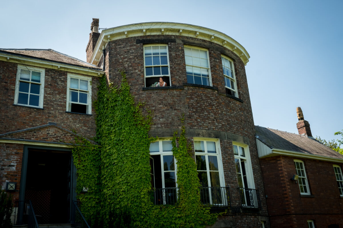 Old brick building with ivy-covered walls