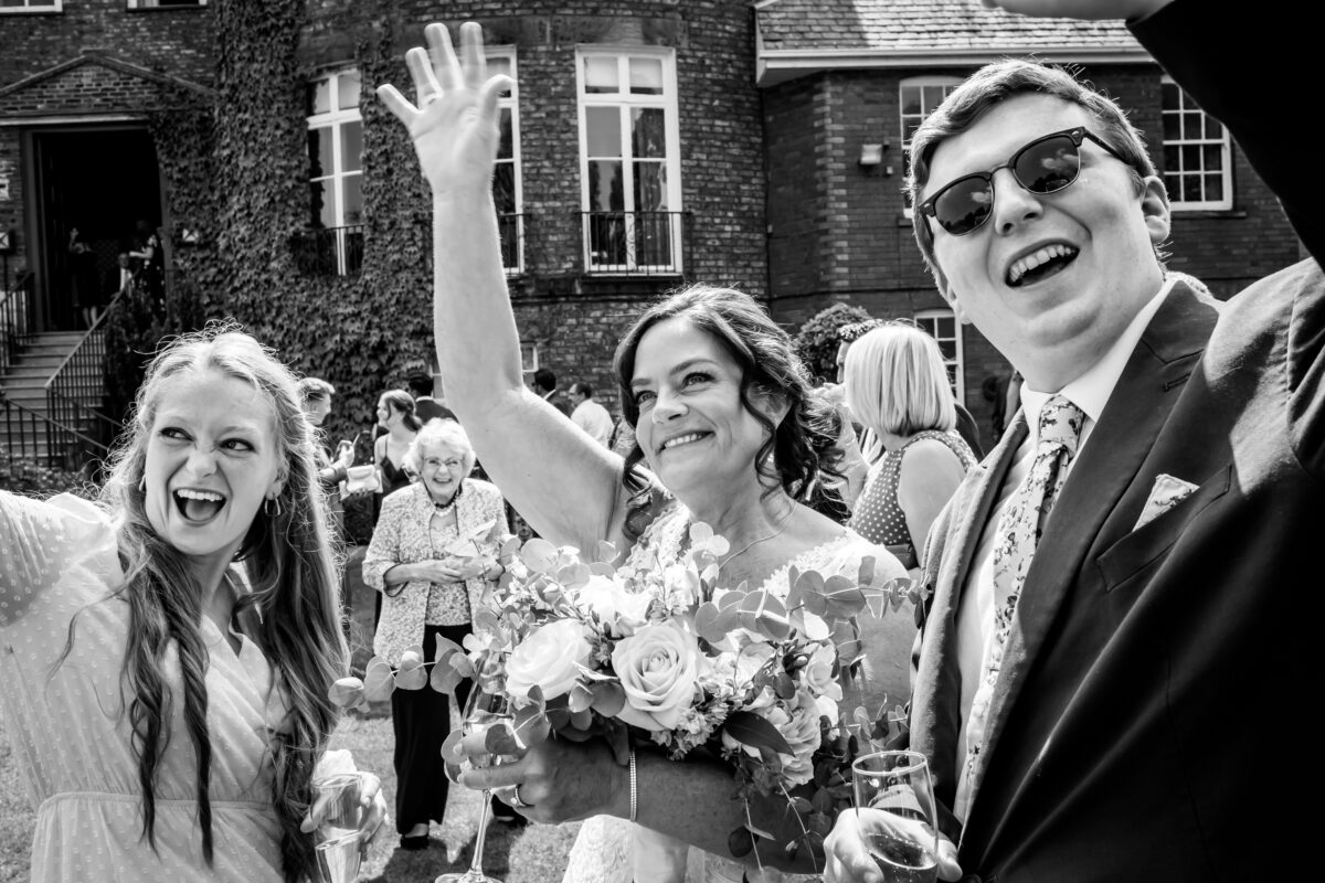 Wedding guests celebrate with joy.