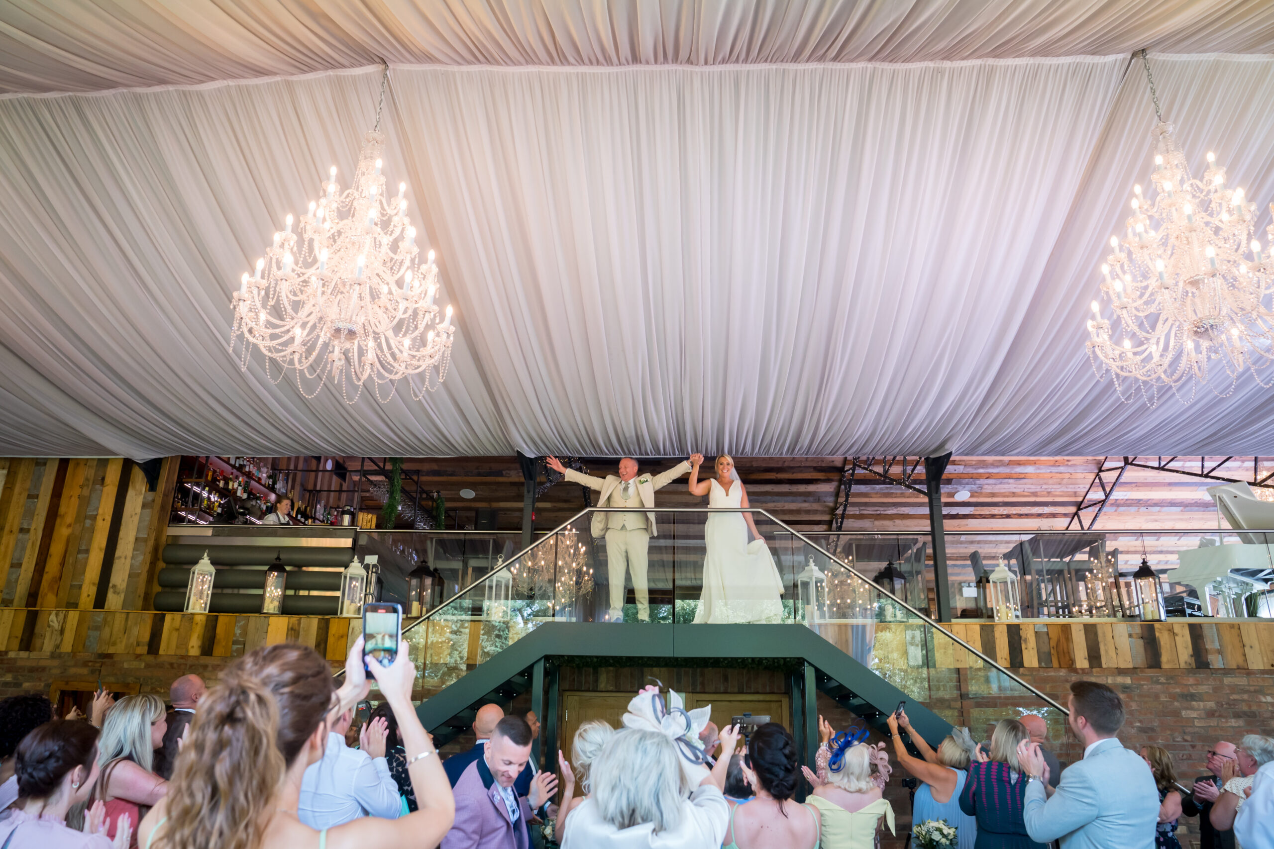 Bride and groom on staircase at wedding