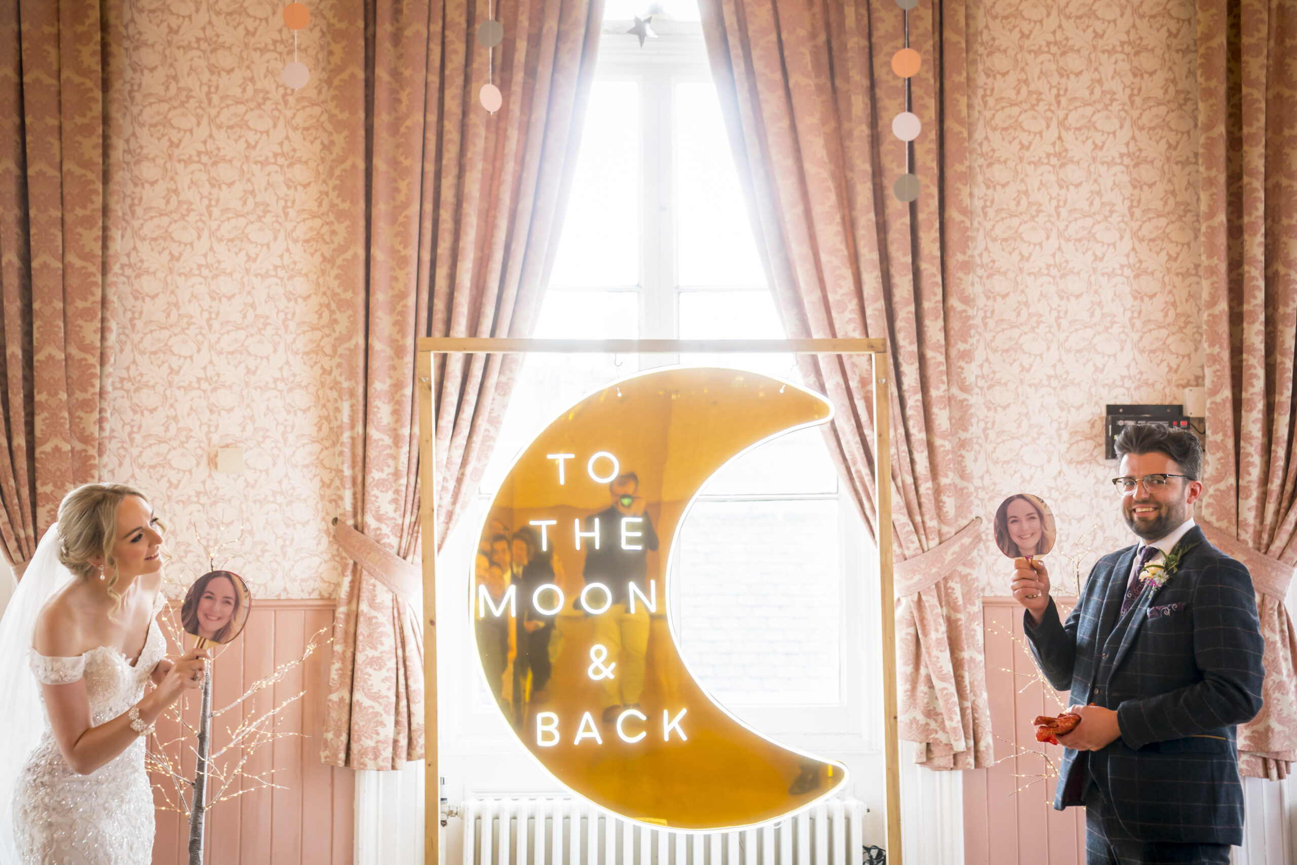 Wedding couple with moon sign backdrop