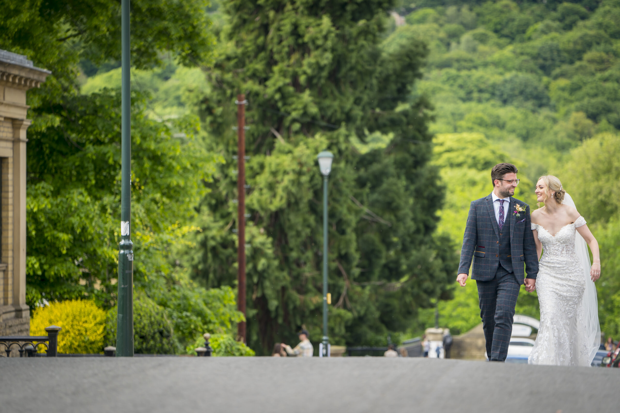 Couple walking on a path surrounded by greenery