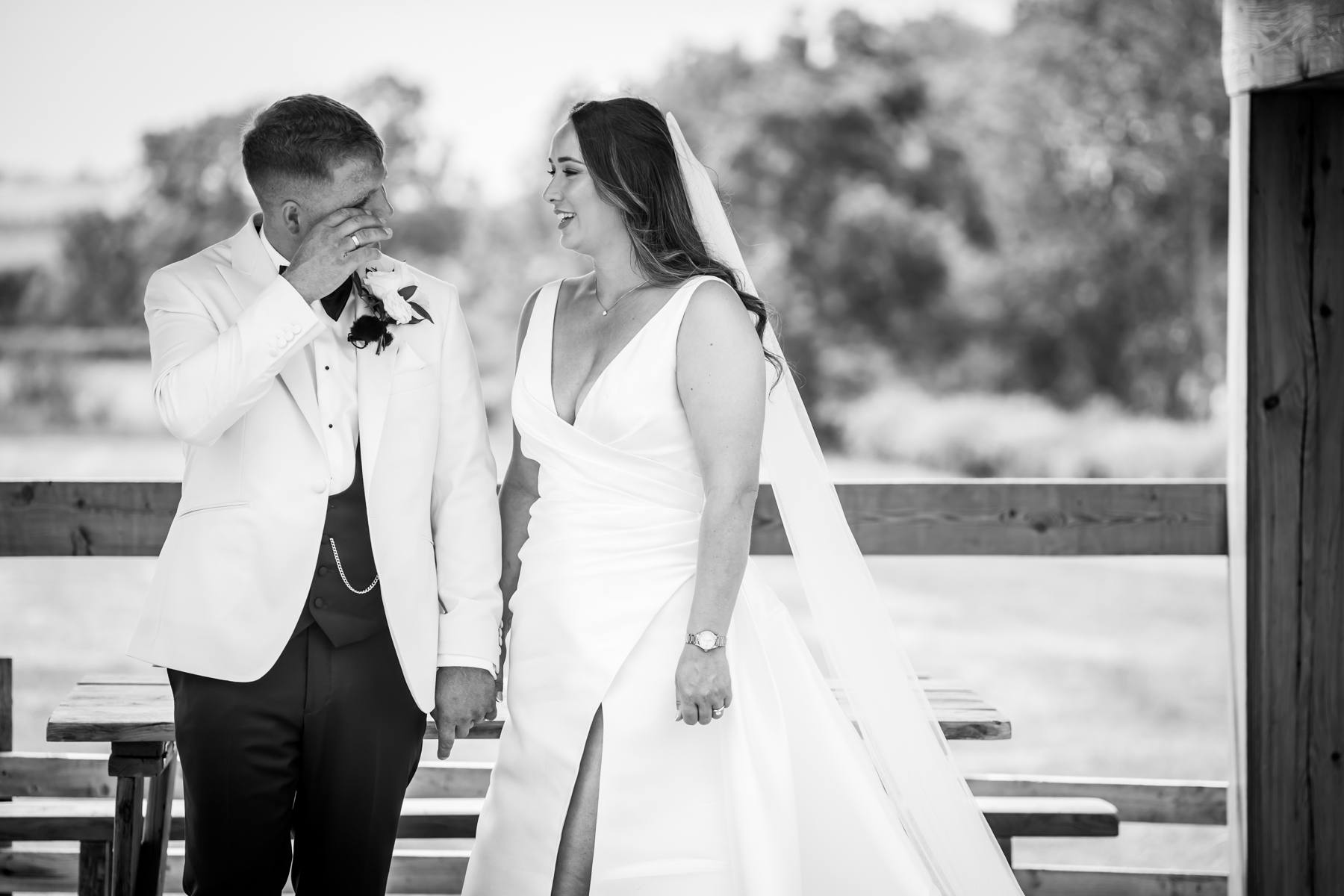 Bride and groom sharing emotional wedding moment