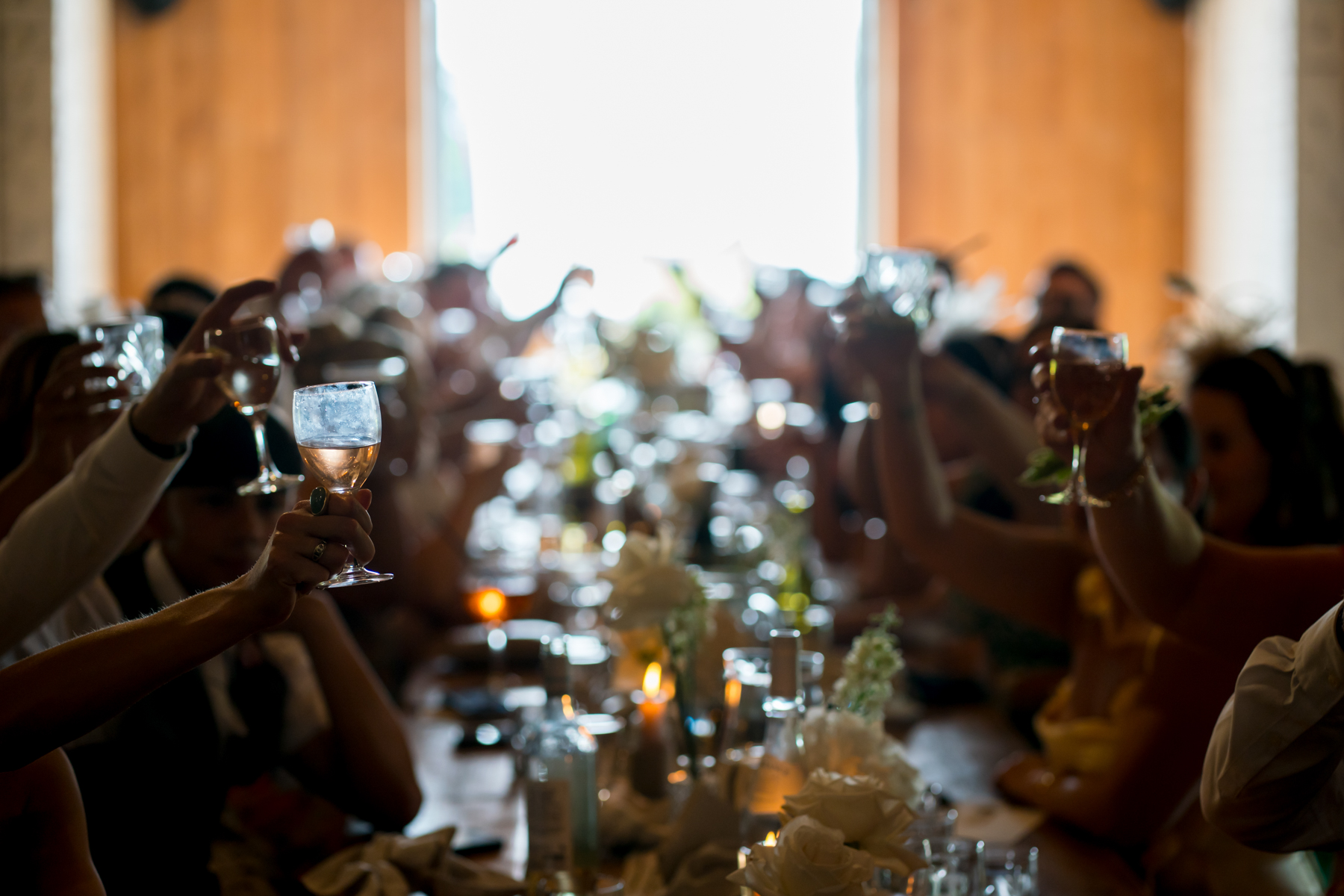 Guests raising glasses for a celebratory toast