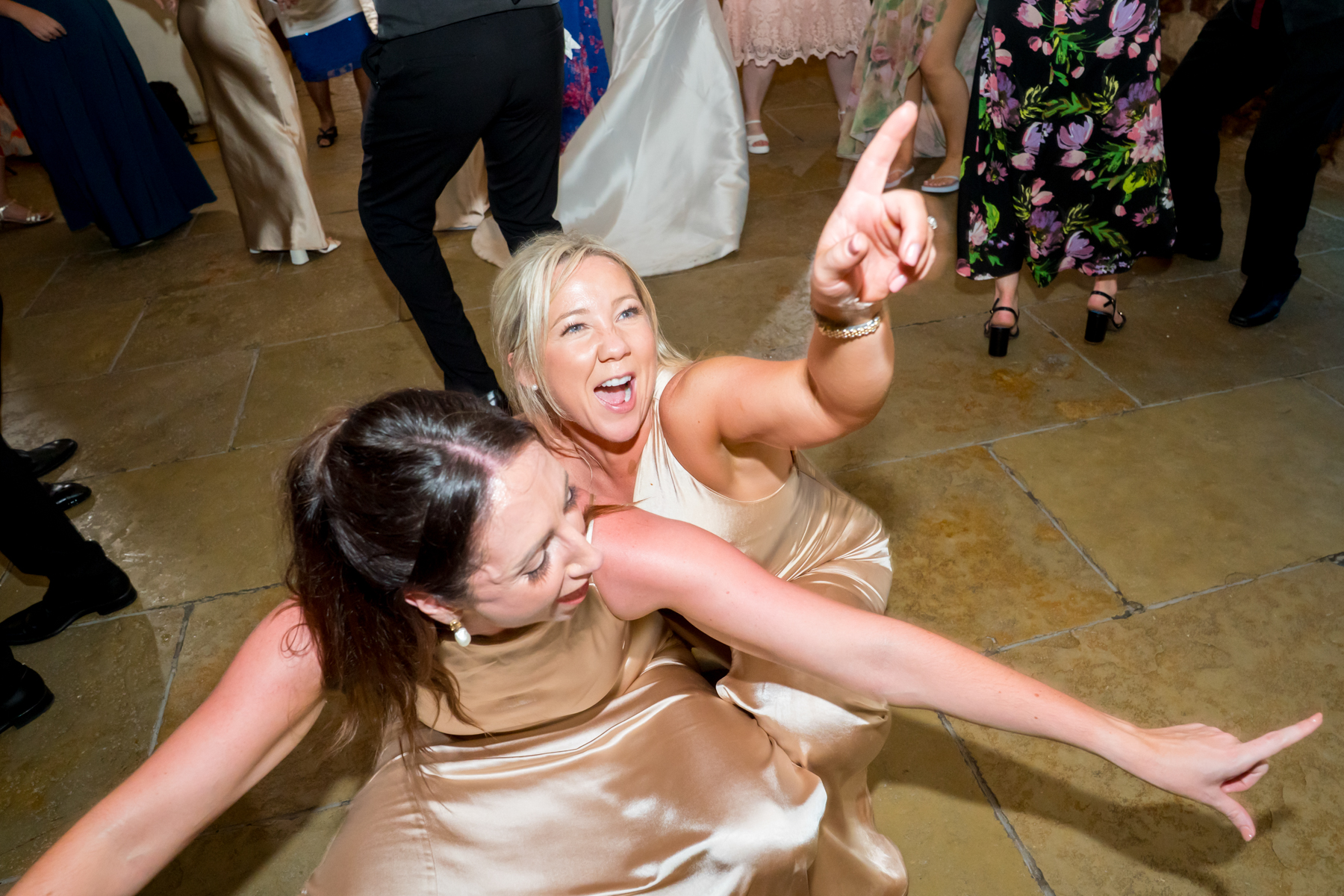 Two women dancing on wedding reception dance floor