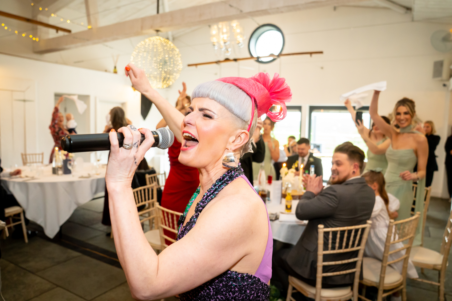 Singer performing at lively wedding reception