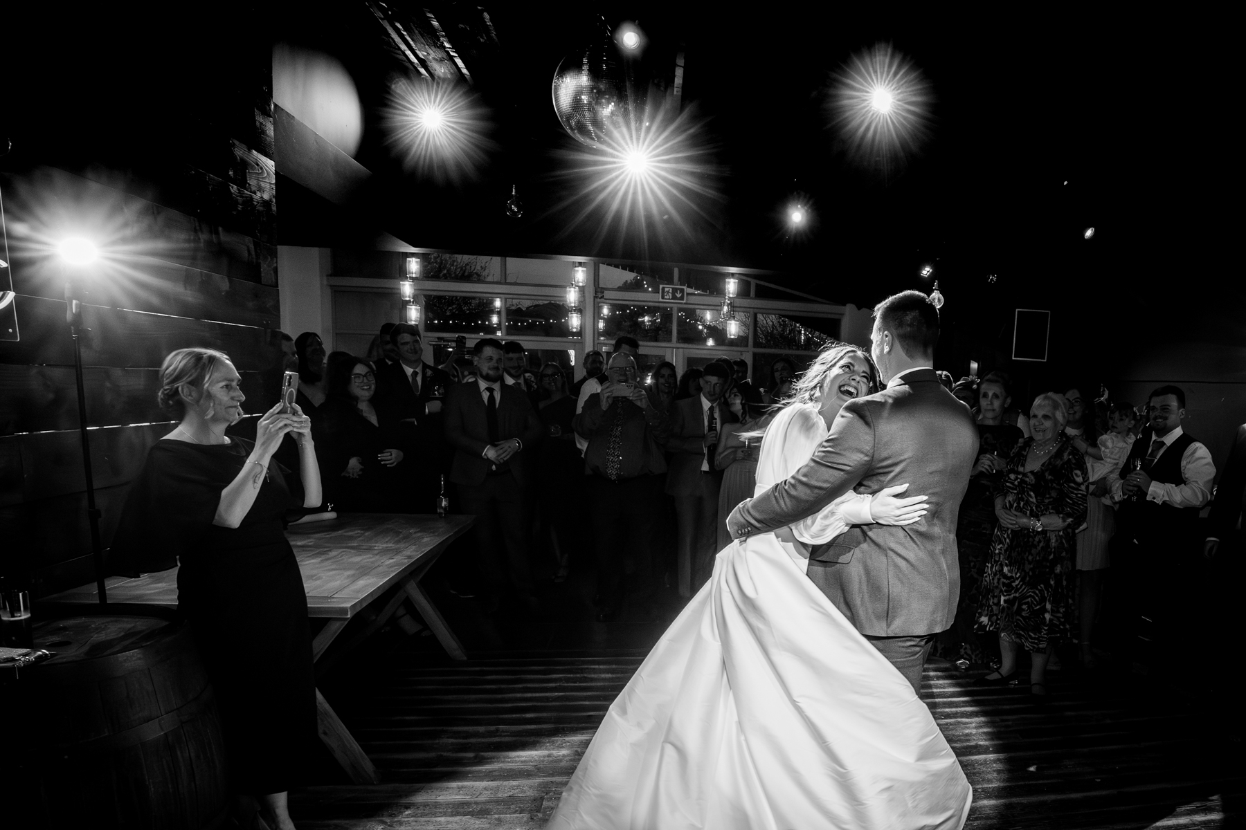 Bride and groom sharing first dance at reception