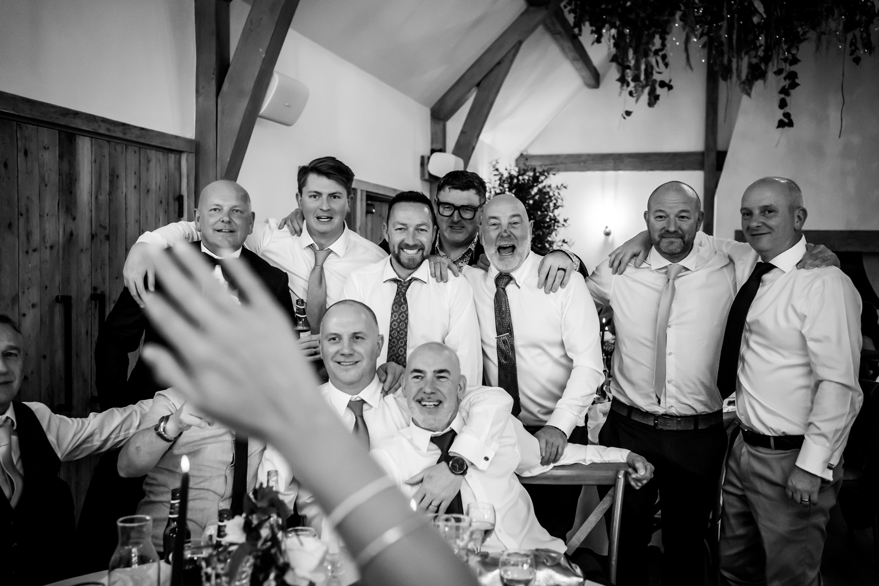 Group of men posing at indoor celebration